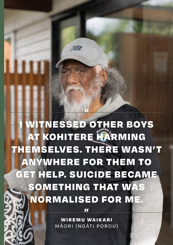 Wiremu Waikari standing outside a house with a wooden fence in the background