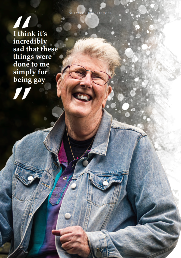 Joan Bellingham, wearing a denim jacket and colourful shirt, smiling at the camera